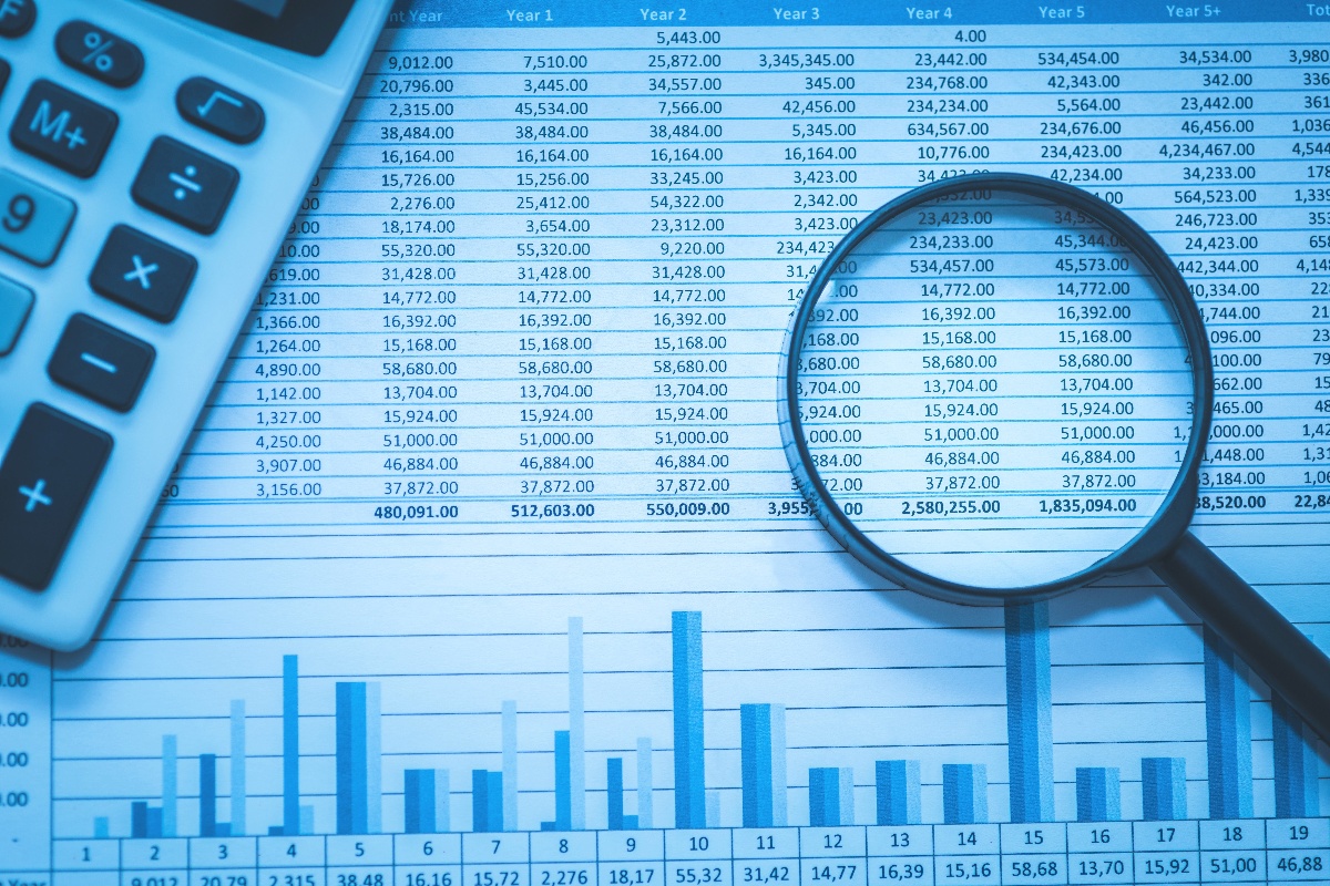 magnifying glass over spreadsheet-1